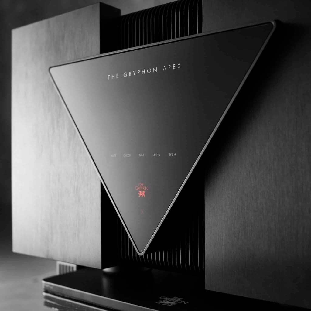 Stereo power amplifier front panel with cooling fins and status indicators